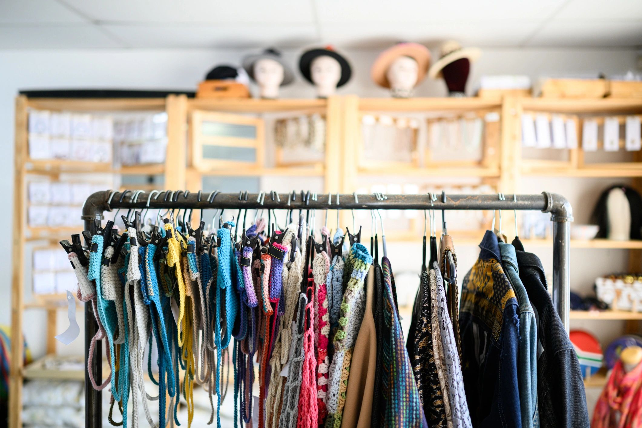 Boutique clothing display with organized garments and elegant retail styling